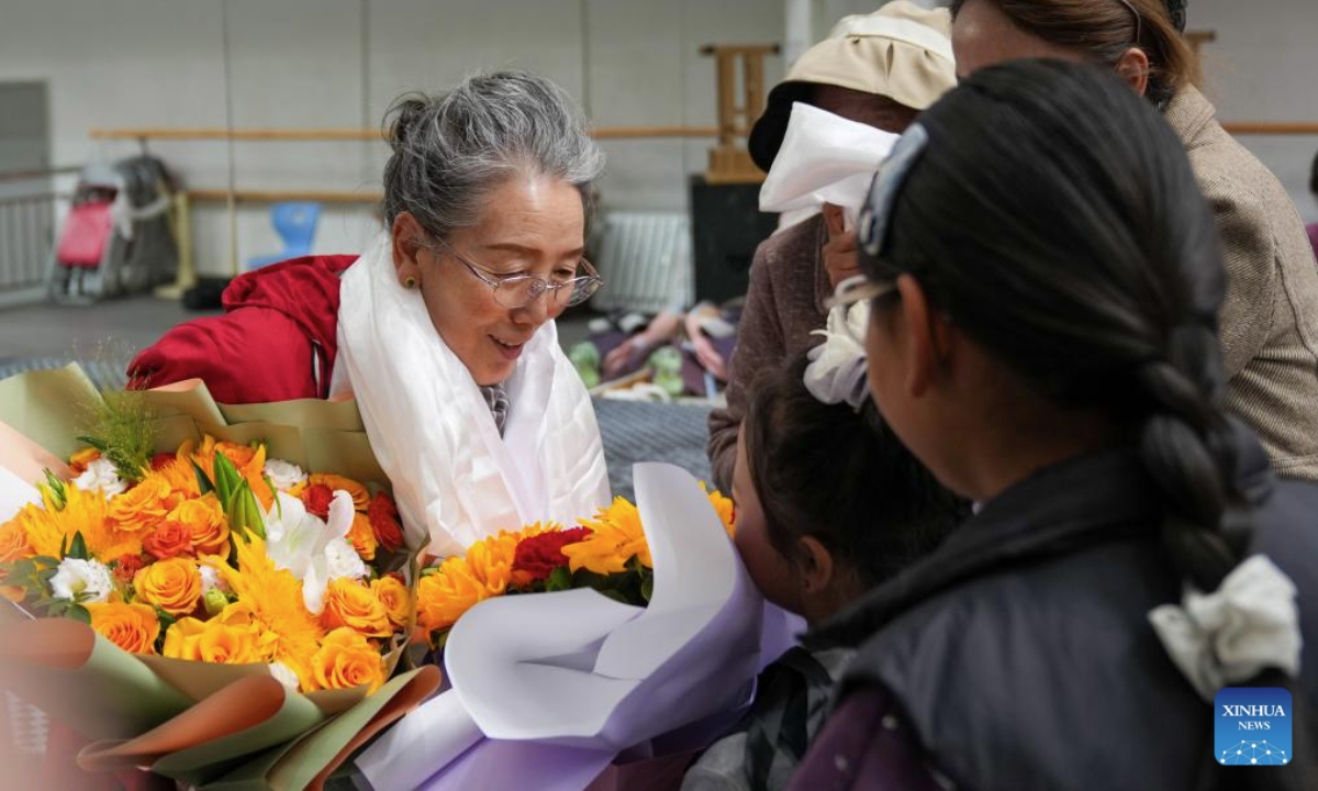 Children present flowers to their teacher Pasang to express their belated Teachers' Day wishes at the public art center in Lhasa, southwest China's Xizang Autonomous Region, Sept. 14, 2025. Pasang, a national first-class performer and retired member of the Tibetan opera troupe of the Xizang Autonomous Region, has voluntarily devoted her weekends to teaching Tibetan opera to children for a decade.

With her help, these children have come to realize the charm of Tibetan opera. Pasang's dedication has not only kept the flame of Tibetan opera alive, but also brought vitality to the traditional art among the younger generation. (Xinhua/Jigme Dorje)
