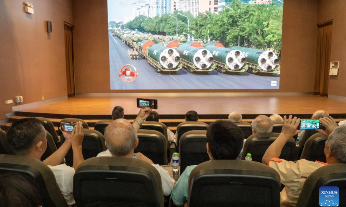 Overseas Chinese watch live broadcasting of a grand gathering to commemorate the 80th anniversary of the victory in the Chinese People's War of Resistance against Japanese Aggression and the World Anti-Fascist War in Kuala Lumpur, Malaysia, Sept. 3, 2025. (Photo by Chong Voon Chung/Xinhua)