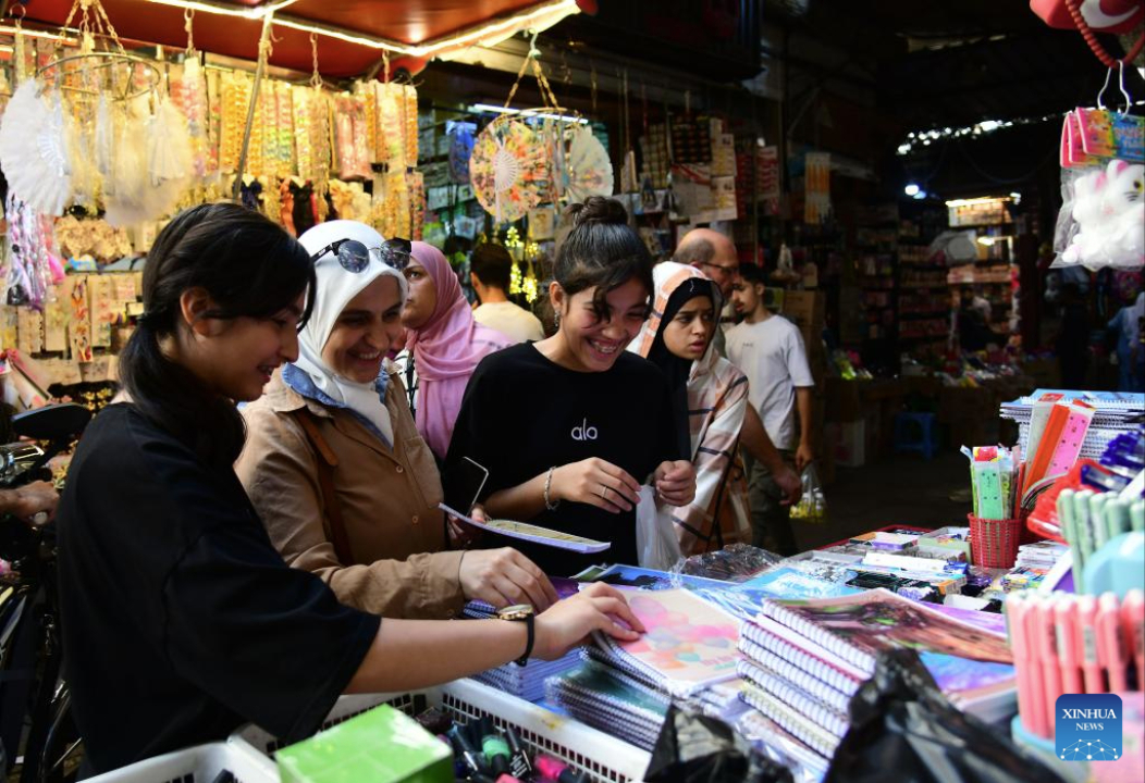 People shop for stationery as the new school year approaches at a market in old Damascus, Syria, Sept. 17, 2025. (Photo by Ammar Safarjalani/Xinhua)