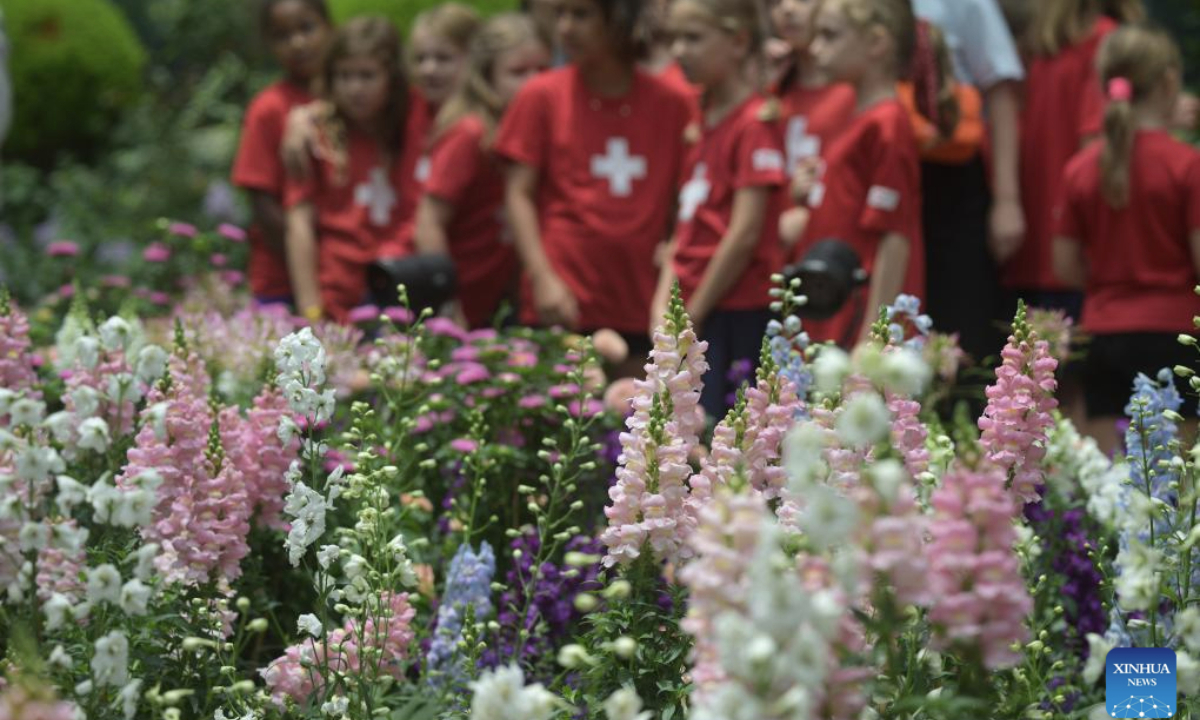 People visit an alpine adventure themed floral display at the Singapore's Gardens by the Bay on Sept. 8, 2025. (Photo by Then Chih Wey/Xinhua)