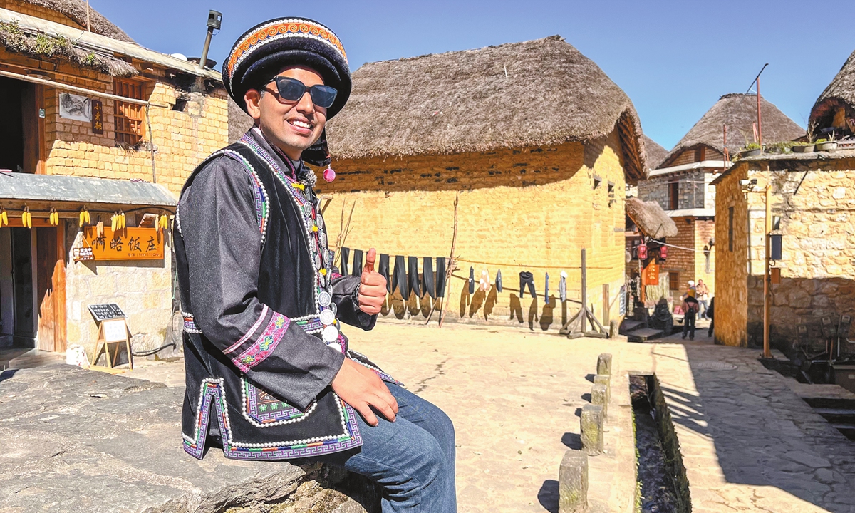 Indian social media influencer Ram Niranjan Sharma tries on local costumes in Southwest China's Yunnan Province, in July 2025. Photo: Courtesy of Sharma 