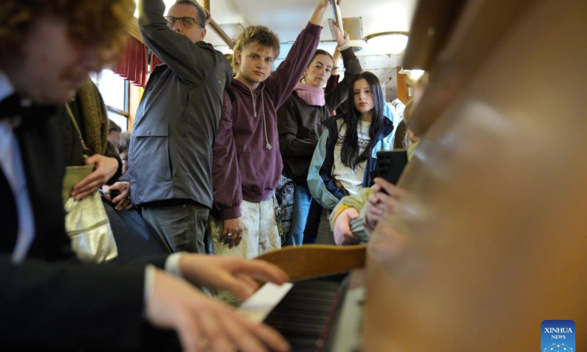 Passengers listen to a pianist playing works by Frederic Chopin aboard a Chopin Tram in Warsaw, Poland, Oct. 9, 2025. The Chopin Tram is a public cultural initiative launched in Warsaw during the International Fryderyk Chopin Piano Competition. Passengers can enjoy live performances of Chopin's music during the ride, turning the city's tram into a moving concert hall.
The 19th International Fryderyk Chopin Piano Competition is currently underway in Warsaw and will run until Oct. 23. (Photo by Jaap Arriens/Xinhua)