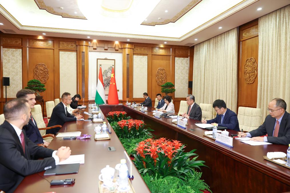 Chinese Foreign Minister Wang Yi, also a member of the Political Bureau of the Communist Party of China Central Committee, meets with Hungarian Minister of Foreign Affairs and Trade Peter Szijjarto, who is in China to attend commemorations marking the 80th anniversary of the victory in the Chinese People's War of Resistance against Japanese Aggression and the World Anti-Fascist War, in Beijing, capital of China, Sept. 3, 2025. (Xinhua/Liu Bin)