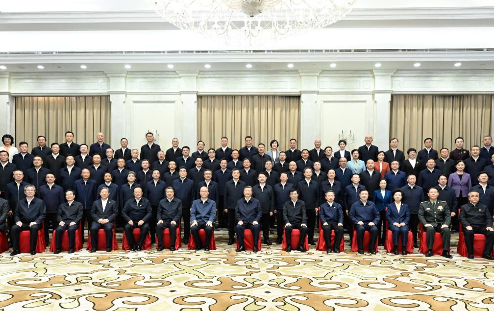 Chinese President Xi Jinping, also general secretary of the Communist Party of China Central Committee and chairman of the Central Military Commission, poses for a group photo while meeting with leaders of the Xinjiang Production and Construction Corps in Urumqi, northwest China's Xinjiang Uygur Autonomous Region, Sept. 23, 2025. (Xinhua/Shen Hong)