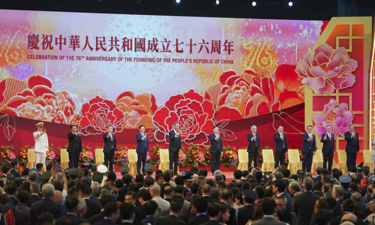 The Hong Kong Special Administrative Region (HKSAR) government holds a flag-raising ceremony and a reception to celebrate the 76th anniversary of the founding of the People's Republic of China in Hong Kong, south China, Oct. 1, 2025. (Xinhua/Lui Siu Wai)