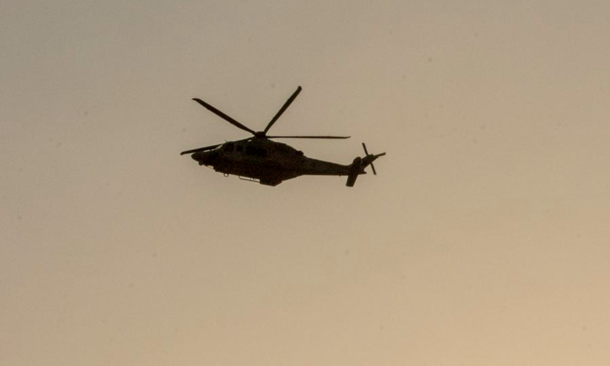 A helicopter is seen near the site of an Israeli airstrike in Doha, Qatar, Sept. 9, 2025. (Photo by Nikku/Xinhua)
