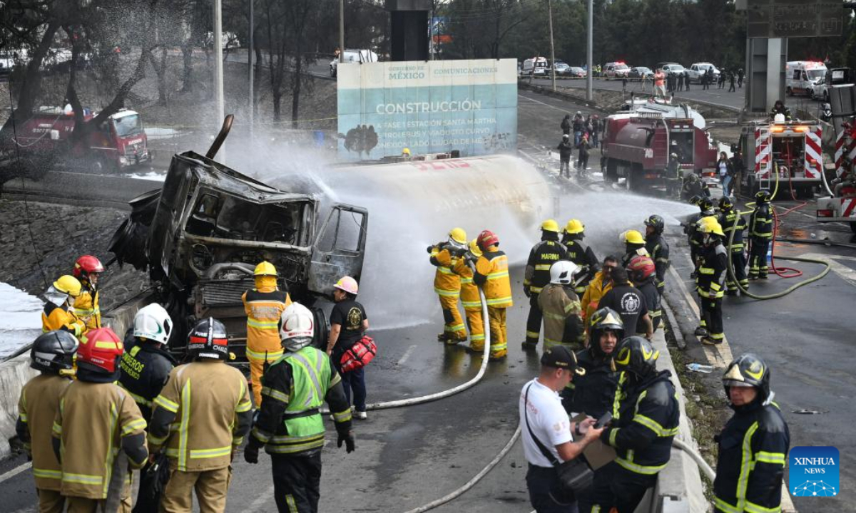 Firefighters work at the gas tanker truck explosion accident site in Mexico City, Mexico, Sept. 10, 2025. Fifty-seven people were injured after a gas tanker truck exploded on Wednesday in Mexico City, with 19 of them in serious condition, local authorities said. (Str/Xinhua)