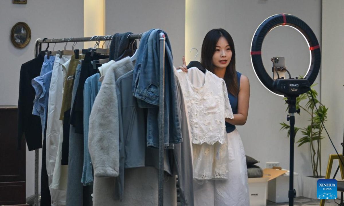 A livestreamer sells clothes in Tianmen City, central China's Hubei Province, Aug. 27, 2025. (Xinhua/Du Zixuan)