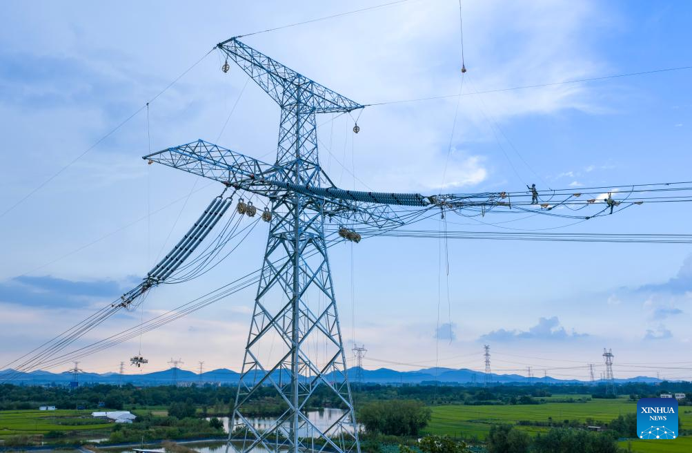 A drone photo taken on Sept. 16, 2025 shows workers carrying out conductor stringing tasks for the Gansu-Zhejiang ±800 kV ultra-high voltage (UHV) direct current transmission project in Nanling County, Wuhu, east China's Anhui Province. The Anhui section of this power transmission project linking northwest China's Gansu Province with east China's Zhejiang Province has recently entered the conductor stringing phase.

The 2,370-kilometer power line starts from Wuwei, Gansu Province and ends in Shaoxing, Zhejiang Province. When in operation, it will facilitate the transmission of clean energy from northwest China and ease the power shortage in east China. (Xinhua/Liu Junxi)