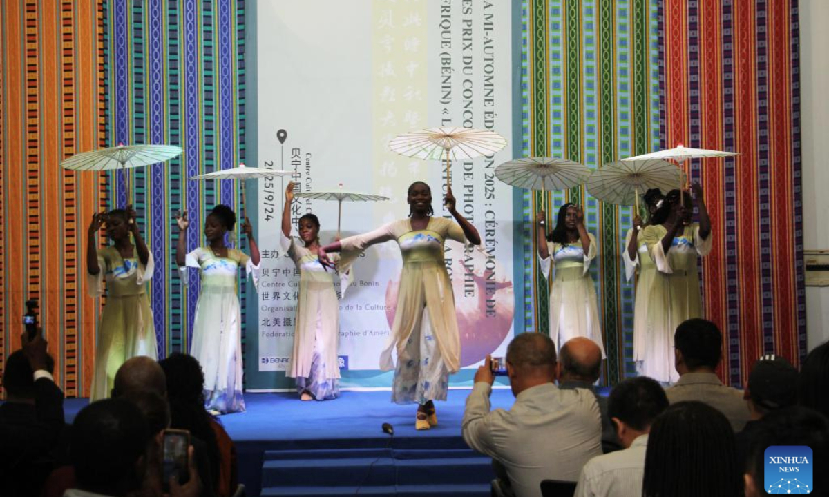 Students from the Confucius Institute perform a traditional Chinese dance during the Mid-Autumn Festival celebration at the Chinese Cultural Center of Benin in Cotonou, Benin, Sept. 24, 2025. A Mid-Autumn Festival celebration was held at the Chinese Cultural Center of Benin on Wednesday. The event, featuring a photo exhibition, mooncake tasting, dance and acrobatic performances, attracted 180 guests from various circles. (Photo by Seraphin Zounyekpe/Xinhua)