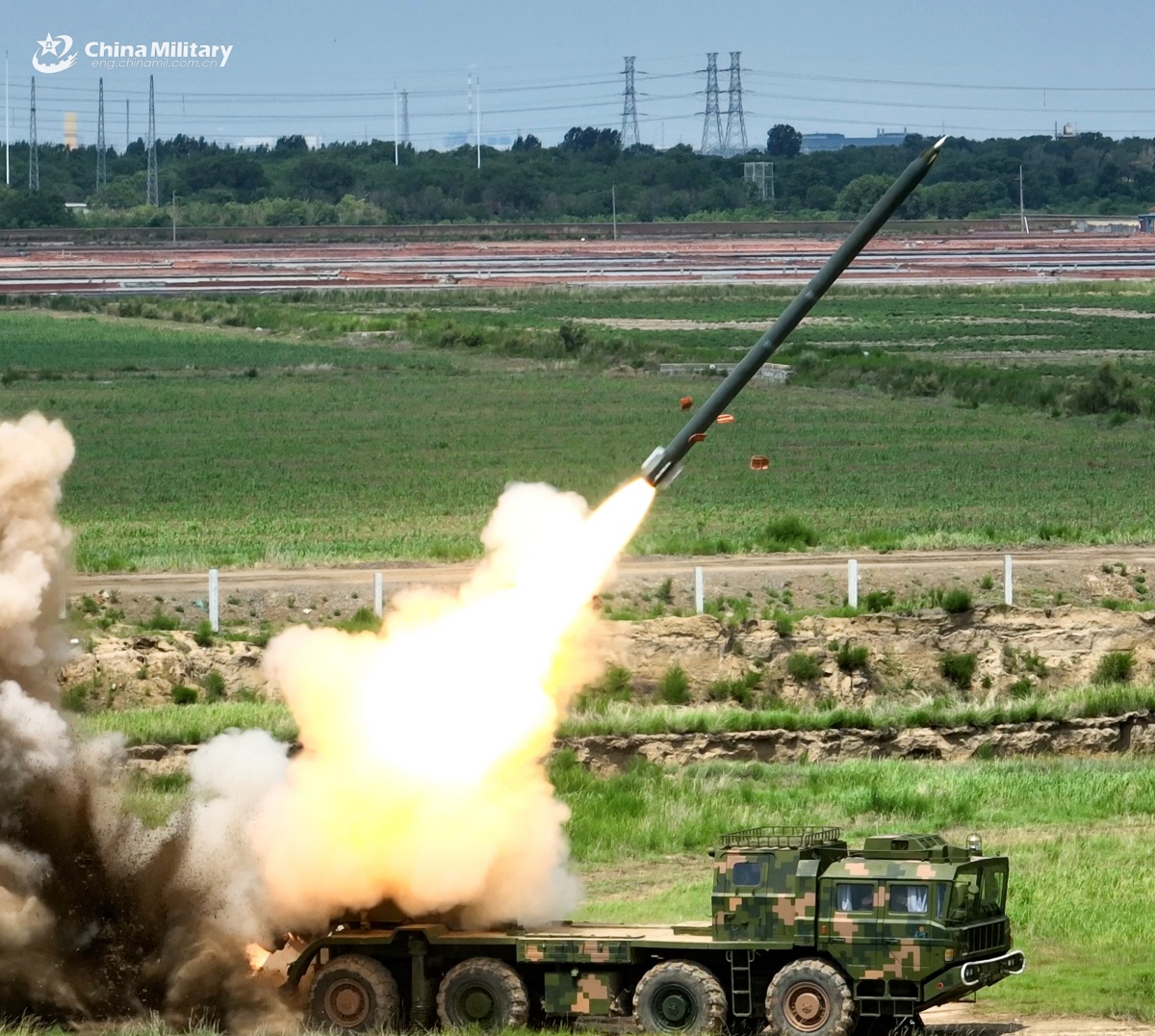 A PHL-03 300mm multiple launch rocket system (MLRS) attached to a brigade under the Chinese PLA 82nd Group Army opens fire during a live-fire shooting training exercise in late September, 2025. (eng.chinamil.com.cn/Photo by Wang Zhengjie)