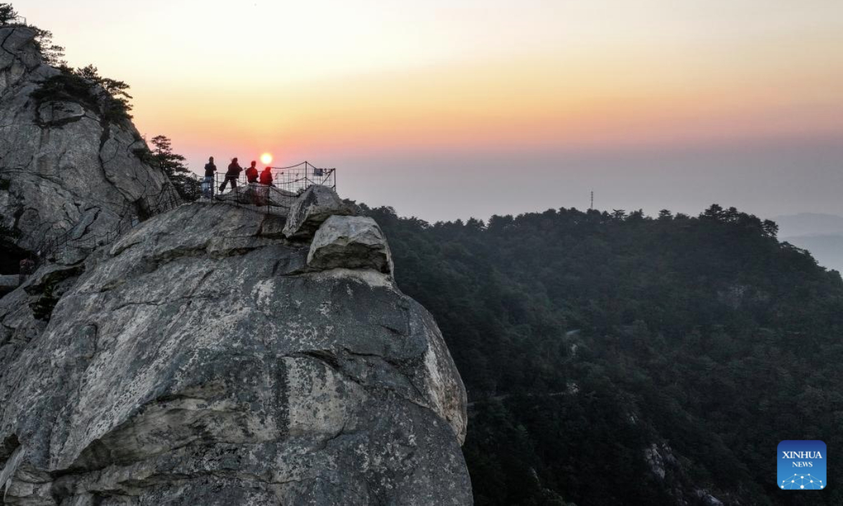An aerial drone photo taken on Oct. 9, 2025 shows the scenery of Guifeng mountain at sunrise in Macheng City, central China's Hubei Province. (Xinhua/Chen Yehua)