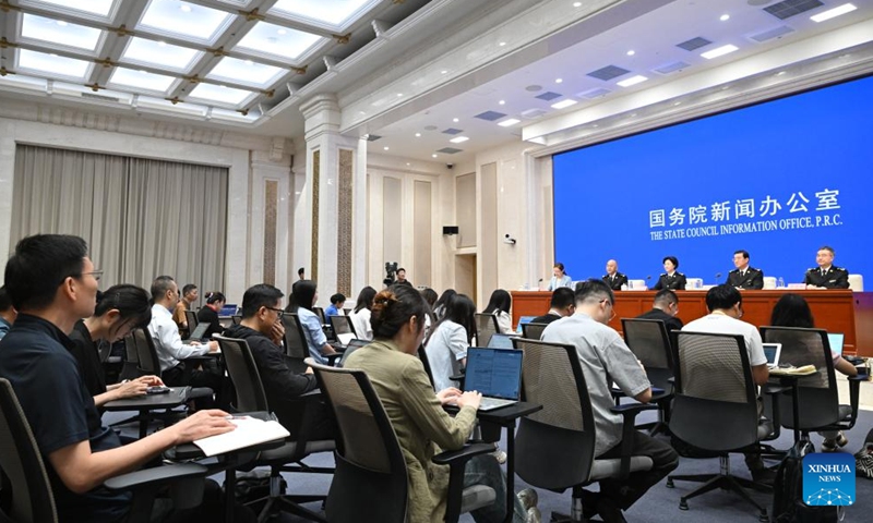 Media professionals work at a press conference held by the State Council Information Office (SCIO) on China Customs' achievements in safeguarding borders and promoting high-quality development in the 14th Five-Year Plan period (2021-2025) in Beijing, capital of China, Aug. 25, 2025. (Xinhua)