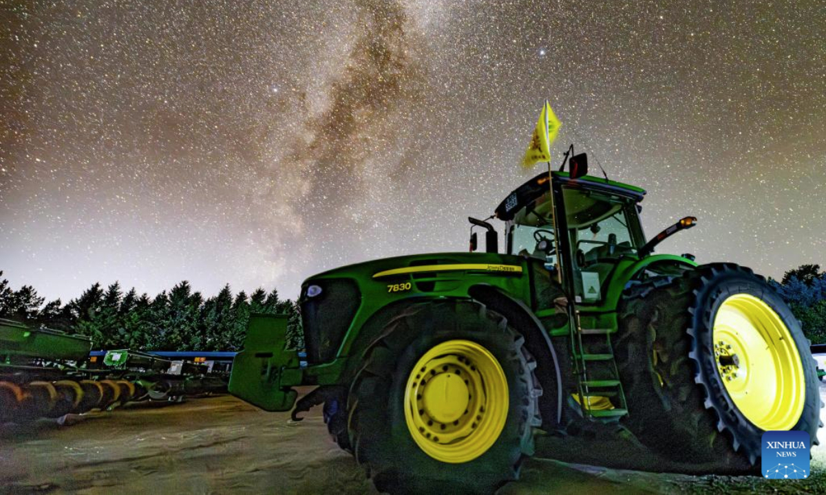 This photo taken on Sept. 19, 2025 shows tractors under the starry sky at a farm under Beidahuang Group in northeast China's Heilongjiang Province. (Photo by Qian Boyu/Xinhua)