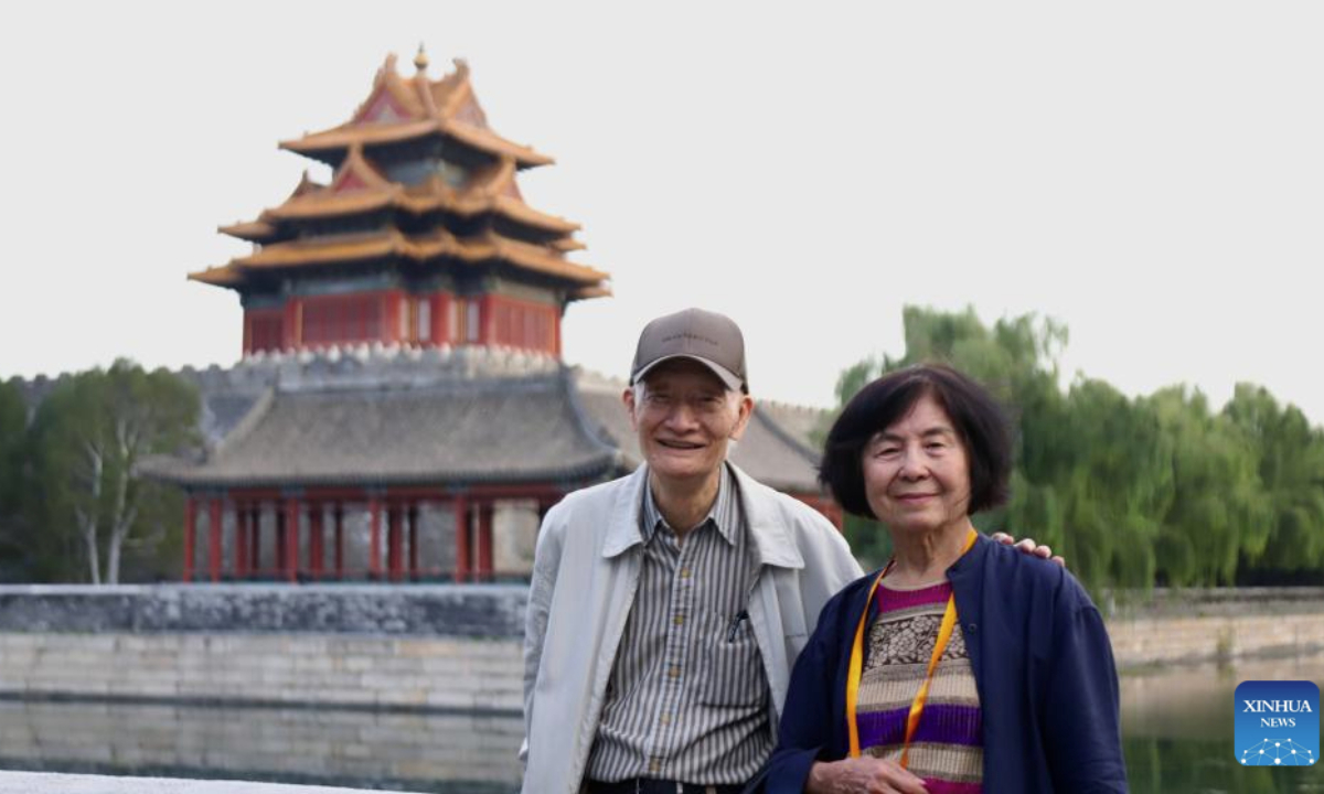 Chuang Ling, the son of Chuang Yan, former vice curator of the Palace Museum in Taipei, poses for a photo with his wife while visiting Beijing for an exhibition commemorating the miraculous evacuation of the Palace Museum's collection during Chinese People's War of Resistance against Japanese Aggression more than 80 years ago, in Beijing, capital of China, Sept. 30, 2025. (Xinhua/Zhu Na)