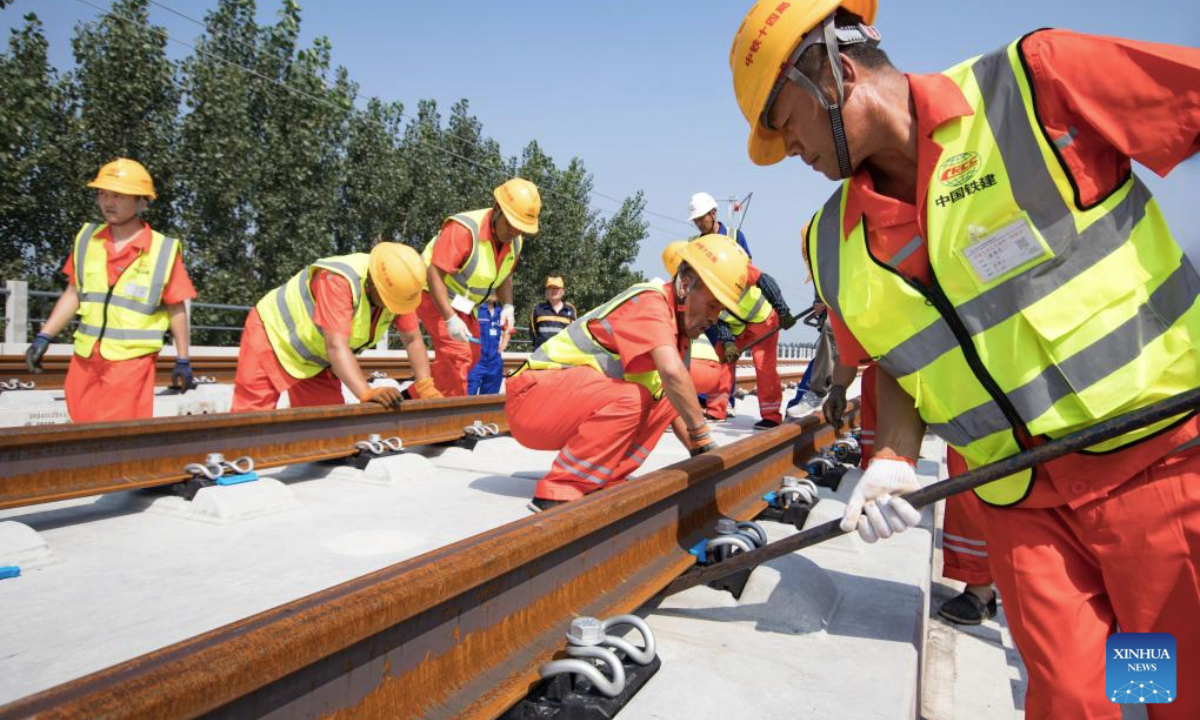 Workers operate at the track laying construction site of the Xiong'an-Shangqiu high-speed railway in Hejian city, north China's Hebei Province, Sept. 1, 2025. Track-laying operation officially kicked off on Monday throughout the Xiong'an-Shangqiu high-speed railway. With a designed speed of 350 km per hour, the 552-kilometer-long railway will connect Xiong'an in north China's Hebei Province and Shangqiu in central China's Henan Province after completion. (Photo by Yuan Ruiyu/Xinhua)