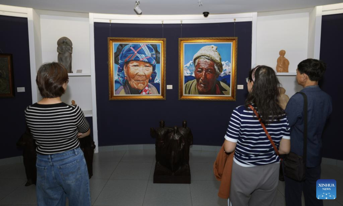 Visitors view paintings at a Chinese and Russian oil painting museum on Pingyuan Street in Harbin, northeast China's Heilongjiang Province, Sept. 7, 2025. Harbin is home to various non-profit private museums with rich collections of cultural relics and historical archive which bear witness to the evolution of a city at the forefront of the East-West cultural exchange. (Xinhua/Wang Song)