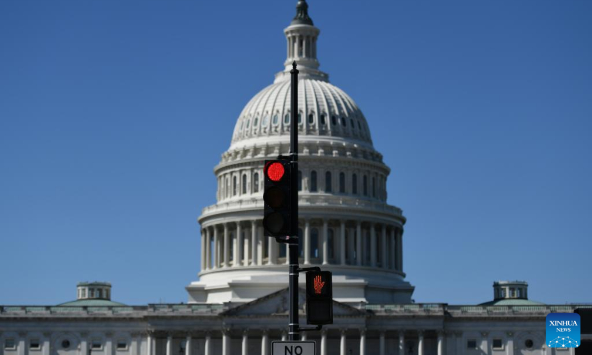 The U.S. Capitol building and traffic lights are seen in Washington, D.C., the United States, Oct. 1, 2025. The U.S. Senate on Wednesday failed to approve a short-term spending bill, as the federal government entered its first shutdown in nearly seven years. (Xinhua/Li Rui)