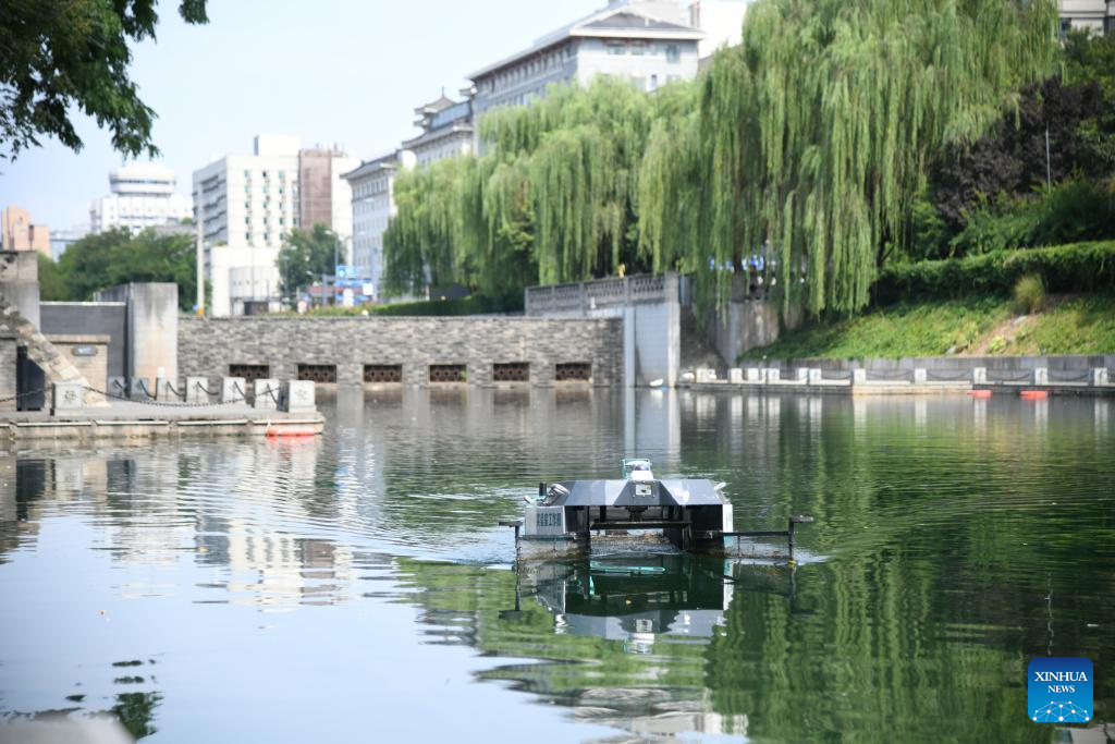 A smart sanitation boat works on the scenic moat in Xi'an, northwest China's Shaanxi Province, July 2, 2024. The 13.74-kilometer-long ancient city wall that surrounds Xi'an is one of the longest and best-preserved of its kind in China. A digital comprehensive management platform has been built for the wall since 2023, which integrates functions such as cultural relic protection, cultural tourism operation, emergency management, and flood-control command.
By comprehensively applying advanced technologies including big data analysis, Internet of Things, etc., the platform provides a digital and intelligent foundation for the protection of this historic city. (Xinhua/Zhang Bowen)