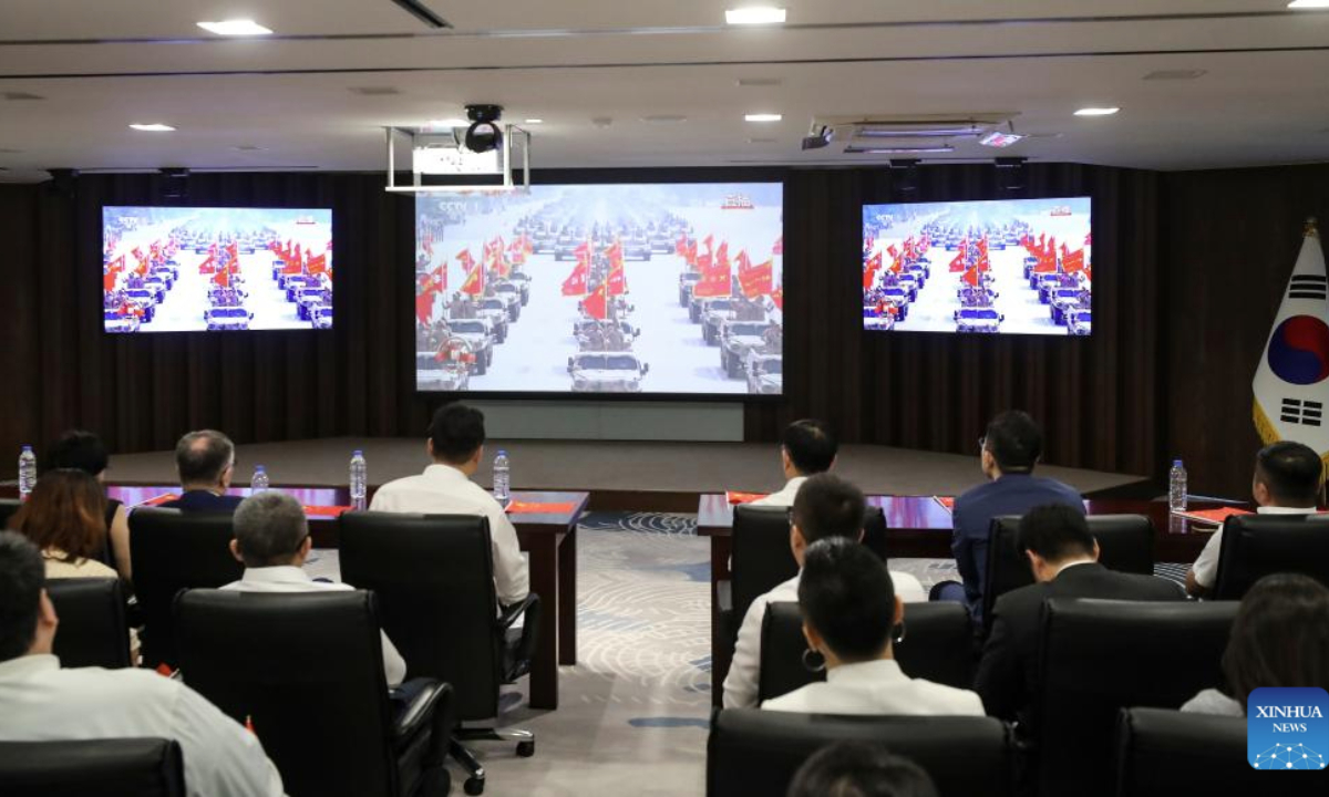 Overseas Chinese watch live broadcasting of a grand gathering to commemorate the 80th anniversary of the victory in the Chinese People's War of Resistance against Japanese Aggression and the World Anti-Fascist War in Seoul, South Korea, Sept. 3, 2025. (Xinhua/Yao Qilin)