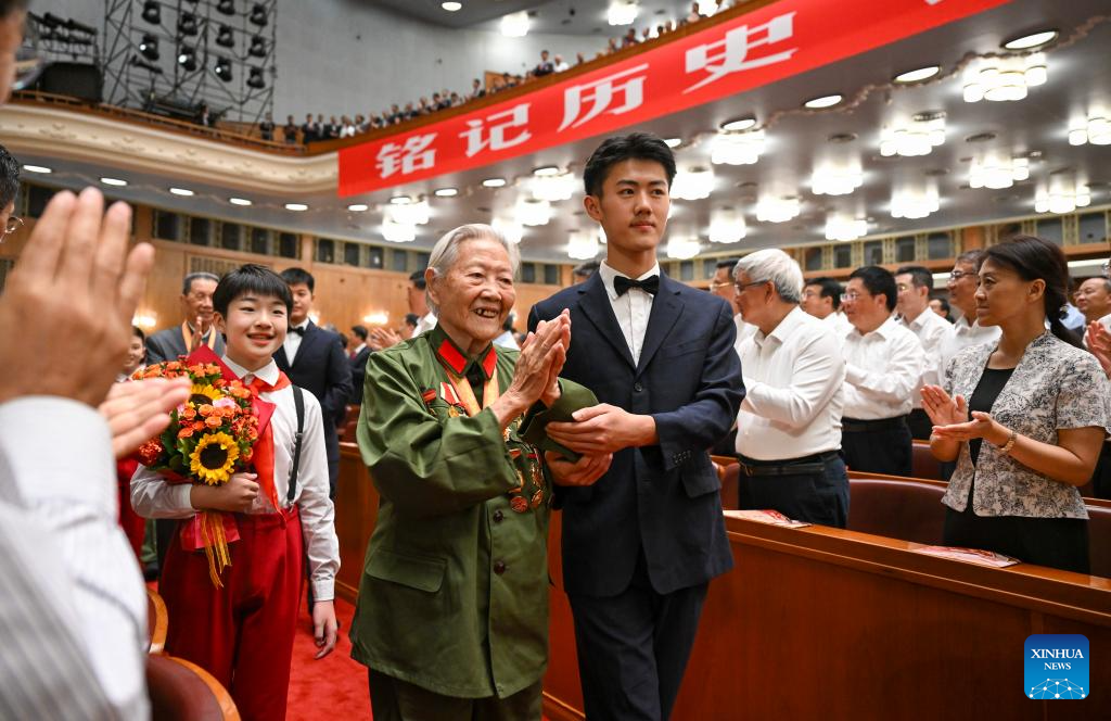 War veterans arrive amid warm applause before a grand cultural gala at the Great Hall of the People in Beijing, capital of China, Sept. 3, 2025. The grand cultural gala with the theme of Justice Prevails was staged here to commemorate the 80th anniversary of the victory of the Chinese People's War of Resistance against Japanese Aggression and the World Anti-Fascist War. (Xinhua/Xie Huanchi)