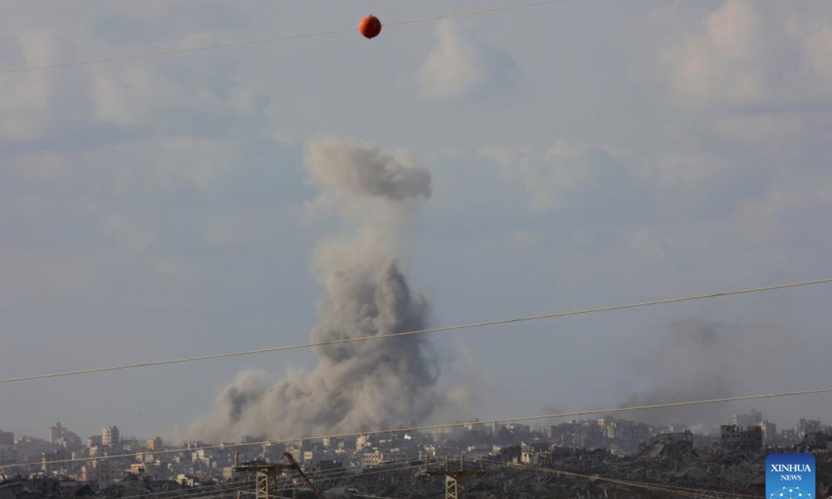 Smoke rises from damaged buildings in Gaza City as seen from southern Israeli border on Sept. 25, 2025. (Photo by Gil Cohen Magen/Xinhua)