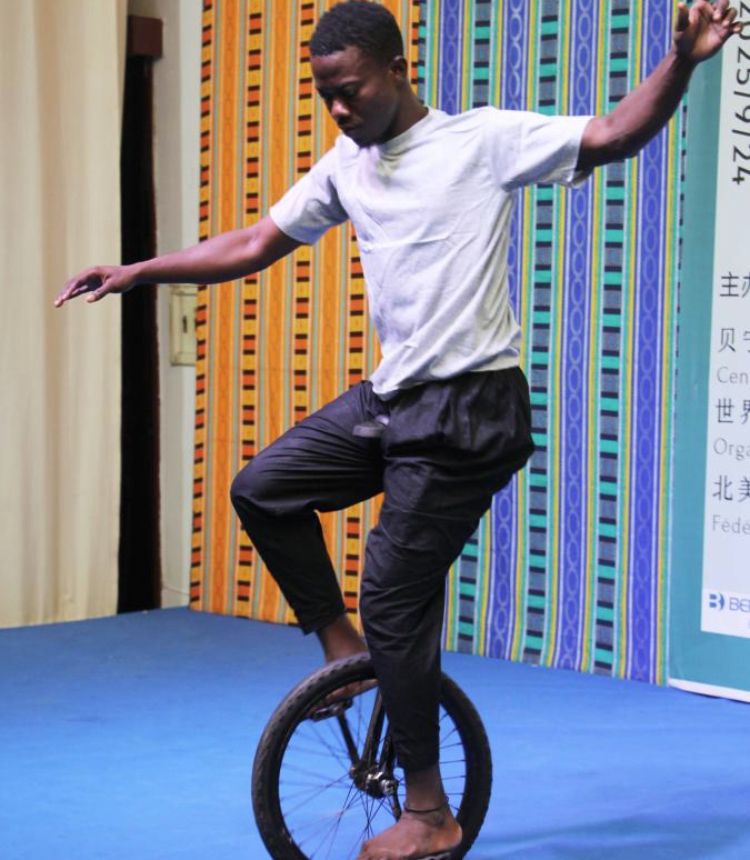 A local artist performs an acrobatic stunt during the Mid-Autumn Festival celebration at the Chinese Cultural Center of Benin in Cotonou, Benin, Sept. 24, 2025. A Mid-Autumn Festival celebration was held at the Chinese Cultural Center of Benin on Wednesday. The event, featuring a photo exhibition, mooncake tasting, dance and acrobatic performances, attracted 180 guests from various circles. (Photo by Seraphin Zounyekpe/Xinhua)