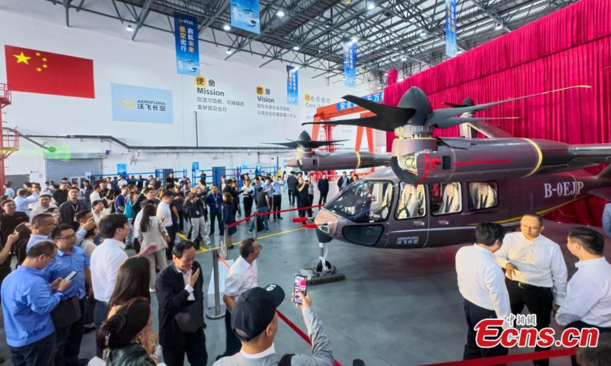 China's first domestically-developed large passenger-carrying eVTOL (electric vertical take-off and landing aircraft) model AE200-100, designed for low-altitude travel, rolls off the assembly line in Chengdu City, Sichuan Province on Sep 29, 2025. Photo:China News Service