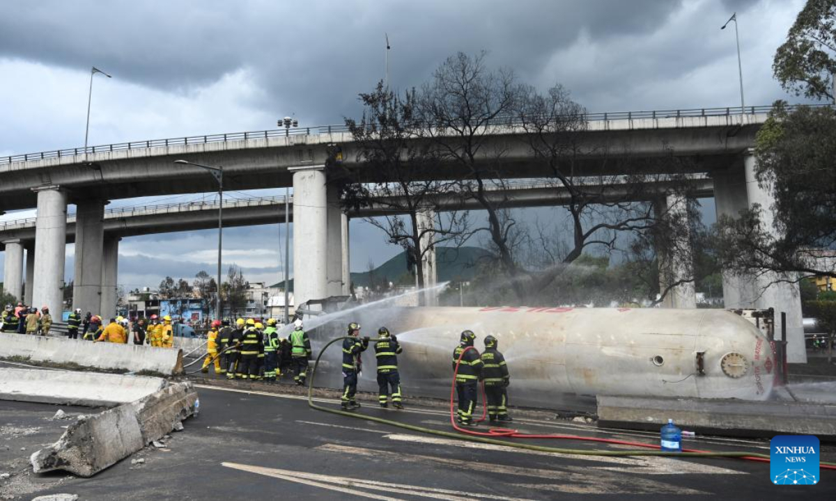 Firefighters work at the gas tanker truck explosion accident site in Mexico City, Mexico, Sept. 10, 2025. Fifty-seven people were injured after a gas tanker truck exploded on Wednesday in Mexico City, with 19 of them in serious condition, local authorities said. (Str/Xinhua)