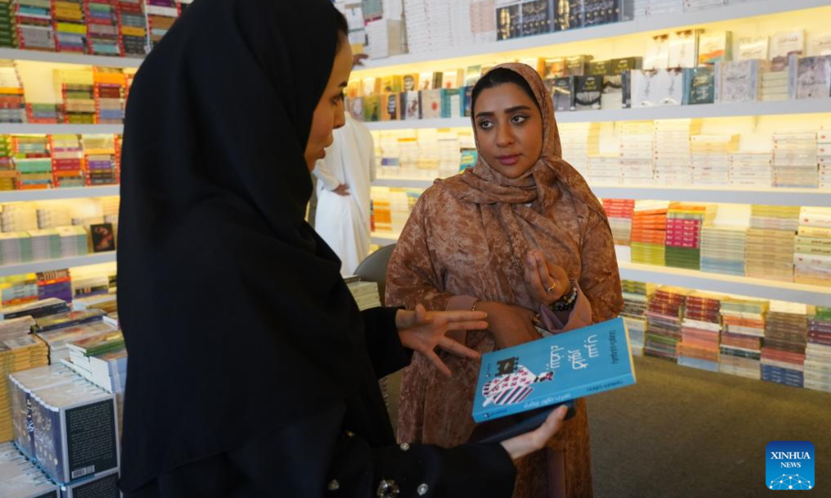 Two women talk at the Riyadh International Book Fair 2025 in Riyadh, Saudi Arabia, Oct. 2, 2025. The book fair opened here on Thursday, bringing together over 2,000 local and international publishing houses from more than 25 countries, along with a range of cultural institutions. (Xinhua/Luo Chen)