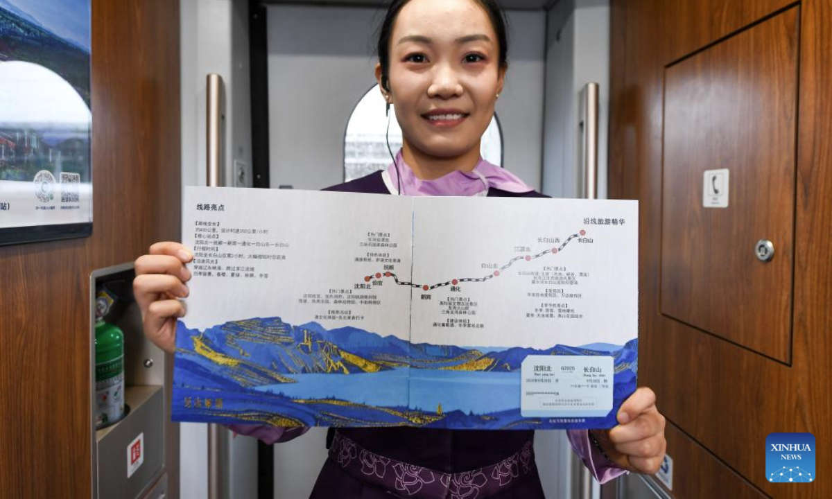 A stewardess shows a commemorative album of Shenyang-Baihe section of the Shenyang-Jiamusi High-Speed Railway on the train G8166 on Sept. 28, 2025. A new high-speed rail link began operation on Sunday, significantly shortening the travel time from China's capital Beijing to the renowned Changbai Mountain in the northeastern province of Jilin, offering a boost to China's growing winter sports and ice tourism market.

The Shenyang-Baihe section of the Shenyang-Jiamusi High-Speed Railway, with a design speed of 350 km per hour, officially commenced service on Sunday. (Xinhua/Zhang Nan)