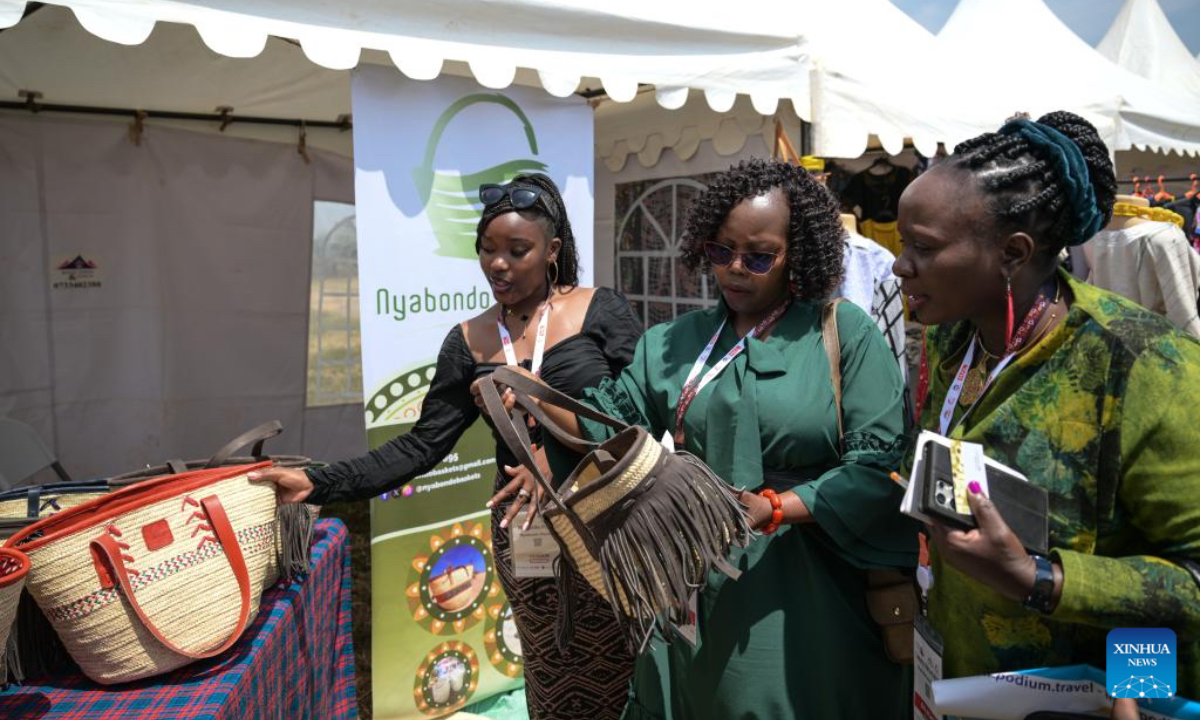 Visitors view hand-woven tote bags made from eco-friendly materials at the 15th edition of the Magical Kenya Travel Expo in Nairobi, Kenya, Oct. 2, 2025. Kenya is hosting the three-day expo, running until Friday, which has attracted 6,500 delegates from 40 countries, including tourism ministers, city mayors, investors, travel enthusiasts, and promoters. (Xinhua/Yang Guang)