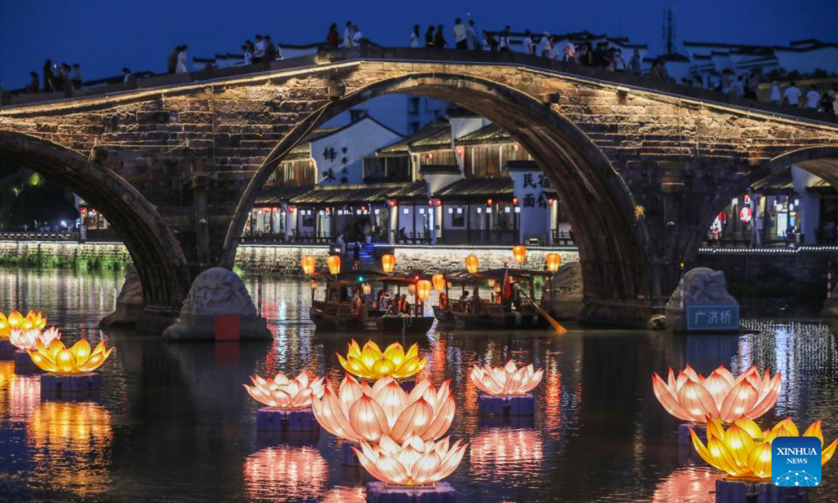 Tourists visit Tangqi ancient town in Hangzhou, east China's Zhejiang Province, Oct. 2, 2025. The town offers tourists night boat tours and dazzling lanterns during the eight-day National Day and Mid-Autumn Festival holiday that began on Wednesday. (Xinhua/Xu Yu)