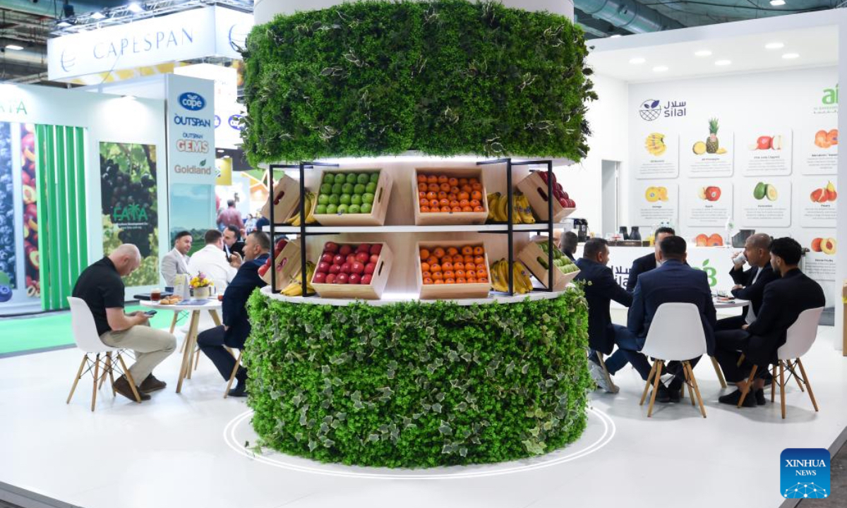 People communicate during the Fruit Attraction in Madrid, Spain, Oct. 2, 2025. The event was held here from Sept. 30 to Oct. 2 this year. (Photo by Gustavo Valiente/Xinhua)
