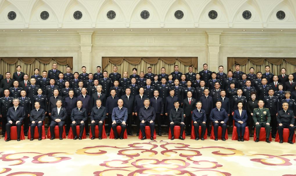 Chinese President Xi Jinping, also general secretary of the Communist Party of China Central Committee and chairman of the Central Military Commission, poses for a group photo while meeting with representatives of judicial workers and police officers in Urumqi, northwest China's Xinjiang Uygur Autonomous Region, Sept. 23, 2025. (Xinhua/Ding Lin)