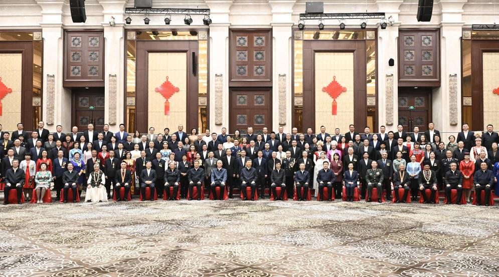 Chinese President Xi Jinping, also general secretary of the Communist Party of China Central Committee and chairman of the Central Military Commission, poses for a group photo while meeting with representatives from all ethnic groups and all walks of life in northwest China's Xinjiang Uygur Autonomous Region, in Urumqi, the regional capital, Sept. 23, 2025. (Xinhua/Yan Yan)