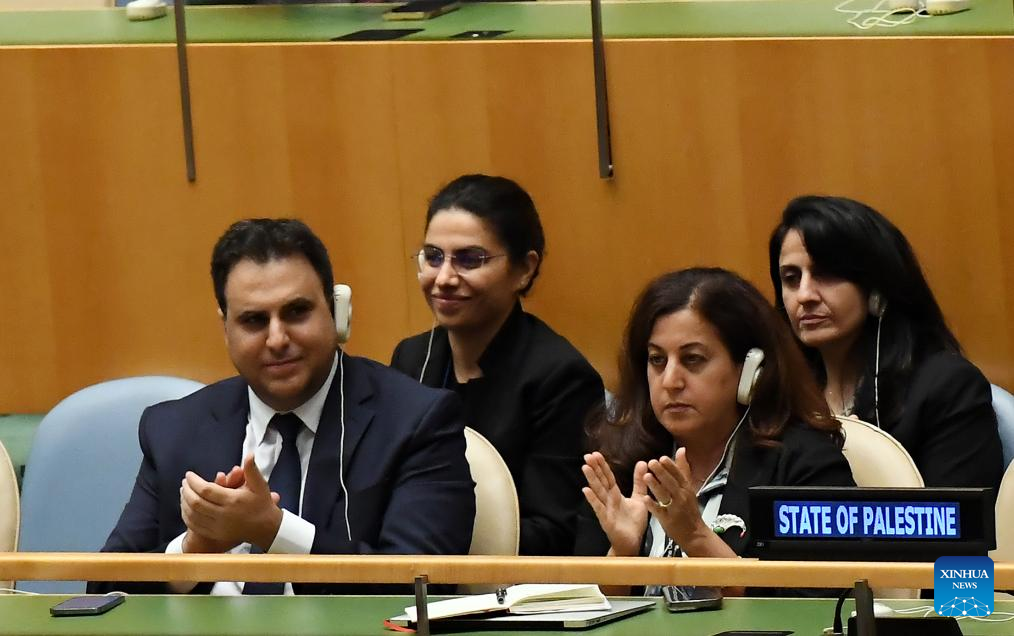 Members of Palestinian delegation applaud during the High-Level International Conference for the Peaceful Settlement of the Question of Palestine and the Implementation of the Two-State Solution at the UN headquarters in New York, Sept. 22, 2025. French President Emmanuel Macron said Monday at a UN meeting on the two-state solution that his country recognizes the State of Palestine, joining most of the other UN member states that have already done so. (Xinhua/Li Rui)