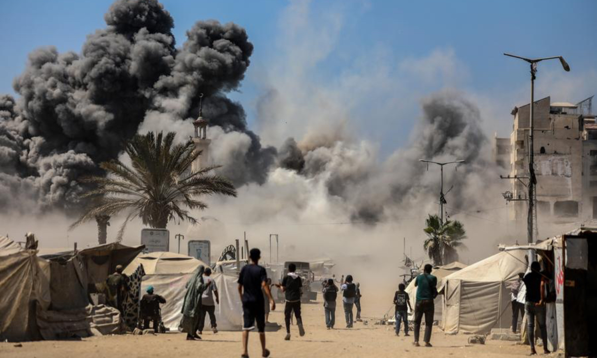 Smoke rises from a collapsed residential building following an Israeli airstrike in Gaza City, Sept. 5, 2025. (Photo by Rizek Abdeljawad/Xinhua)