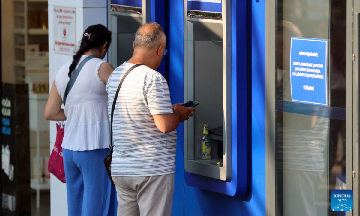 People withdraw money from an ATM in Ankara, Türkiye, on Sept. 3, 2025. Türkiye's annual inflation eased to 32.95 percent in August, marking the fifteenth consecutive month of decrease, official data showed Wednesday. (Mustafa Kaya/Handout via Xinhua)