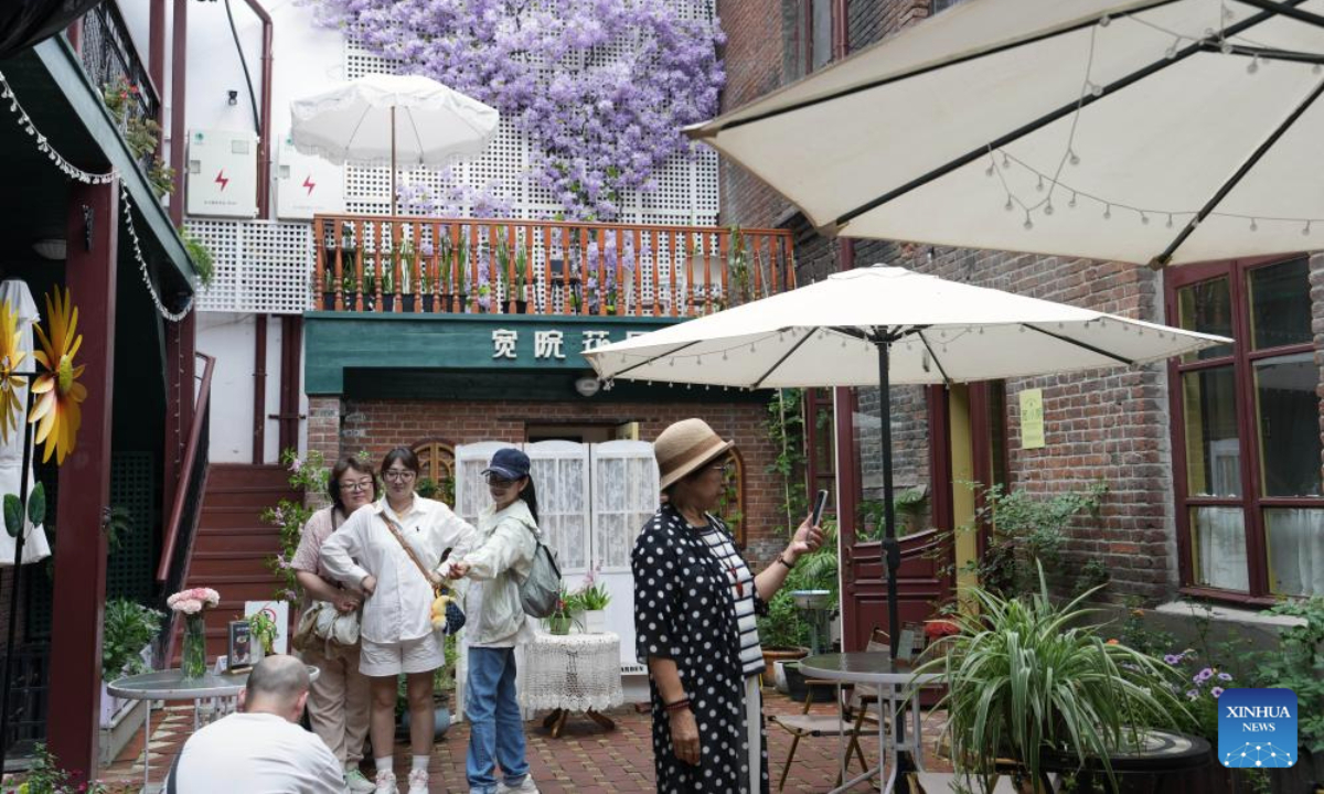 Visitors are seen at the Kuanjie Street Museum in Harbin, northeast China's Heilongjiang Province, Sept. 3, 2025. Harbin is home to various non-profit private museums with rich collections of cultural relics and historical archive which bear witness to the evolution of a city at the forefront of the East-West cultural exchange. (Xinhua/Wang Song)