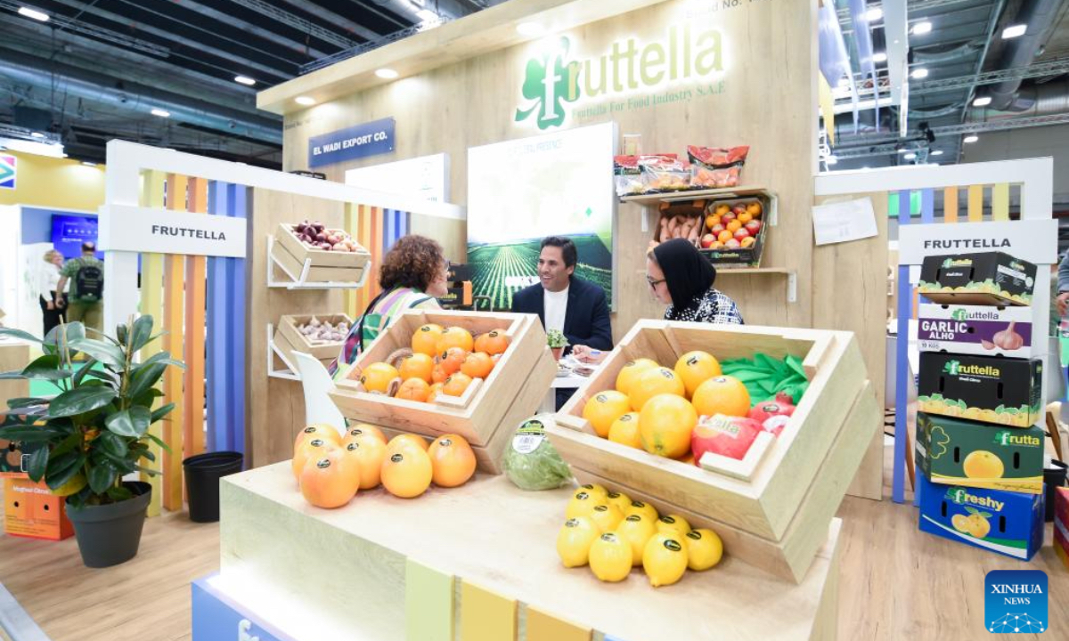 People communicate during the Fruit Attraction in Madrid, Spain, Oct. 2, 2025. The event was held here from Sept. 30 to Oct. 2 this year. (Photo by Gustavo Valiente/Xinhua)