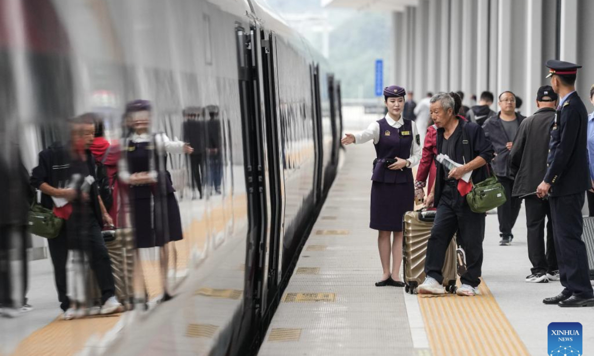 Passengers walk to board a train of the Shenyang-Baihe section of the Shenyang-Jiamusi High-Speed Railway at Fushun Railway Station in Fushun, northeast China's Liaoning Province, Sept. 28, 2025. A new high-speed rail link began operation on Sunday, significantly shortening the travel time from China's capital Beijing to the renowned Changbai Mountain in the northeastern province of Jilin, offering a boost to China's growing winter sports and ice tourism market.

The Shenyang-Baihe section of the Shenyang-Jiamusi High-Speed Railway, with a design speed of 350 km per hour, officially commenced service on Sunday. (Xinhua/Pan Yulong)