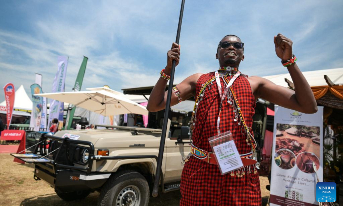 A Maasai man dances in front of an open-top safari vehicle to attract visitors at the 15th edition of the Magical Kenya Travel Expo in Nairobi, Kenya, Oct. 2, 2025. Kenya is hosting the three-day expo, running until Friday, which has attracted 6,500 delegates from 40 countries, including tourism ministers, city mayors, investors, travel enthusiasts, and promoters. (Xinhua/Yang Guang)
