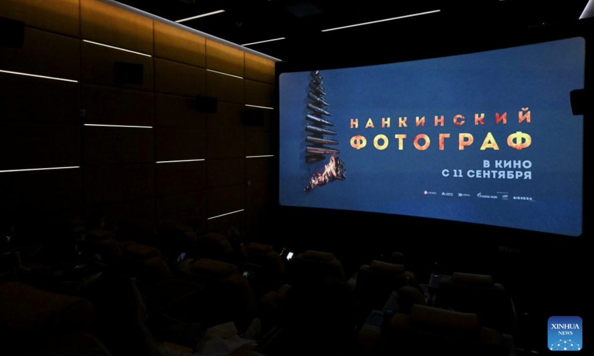 Audiences pass by a poster of the film Dead to Rights at a cinema in Moscow, Russia, Sept. 9, 2025.(Xinhua/Hao Jianwei)