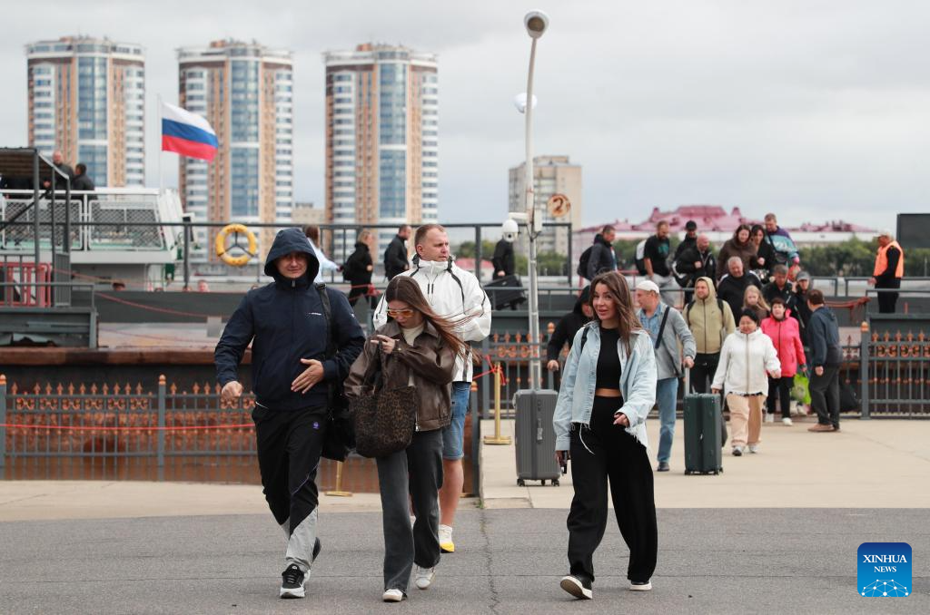Russian travelers are seen on their way to the border inspection hall at a port in Heihe, northeast China's Heilongjiang Province, Sept. 15, 2025. On Sept. 2, China announced a trial visa-free policy for Russian citizens holding ordinary passports, effective from Sept. 15, 2025, to Sept. 14, 2026.

Russian citizens holding ordinary passports who come to China for business, tourism, visiting relatives and friends or exchange visits and transit for no more than 30 days can enter China visa-free. (Photo by Liu Song/Xinhua)