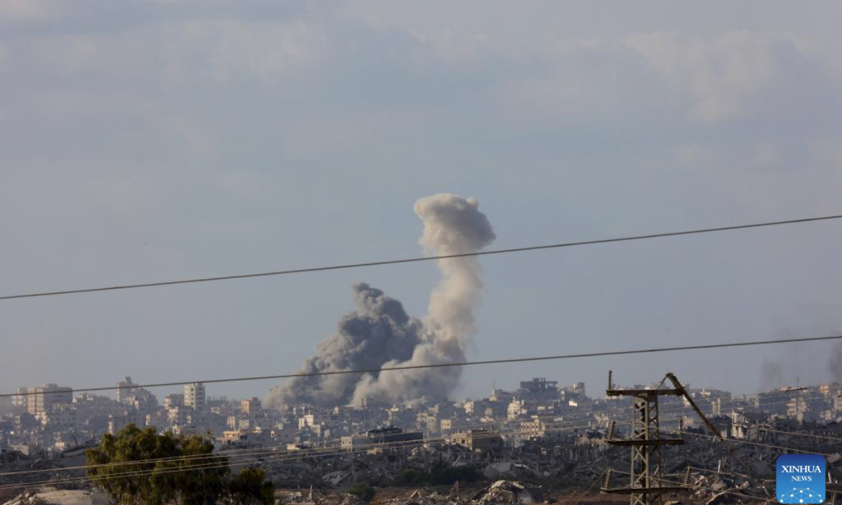 Smoke rises from damaged buildings in Gaza City as seen from southern Israeli border on Sept. 25, 2025. (Photo by Gil Cohen Magen/Xinhua)