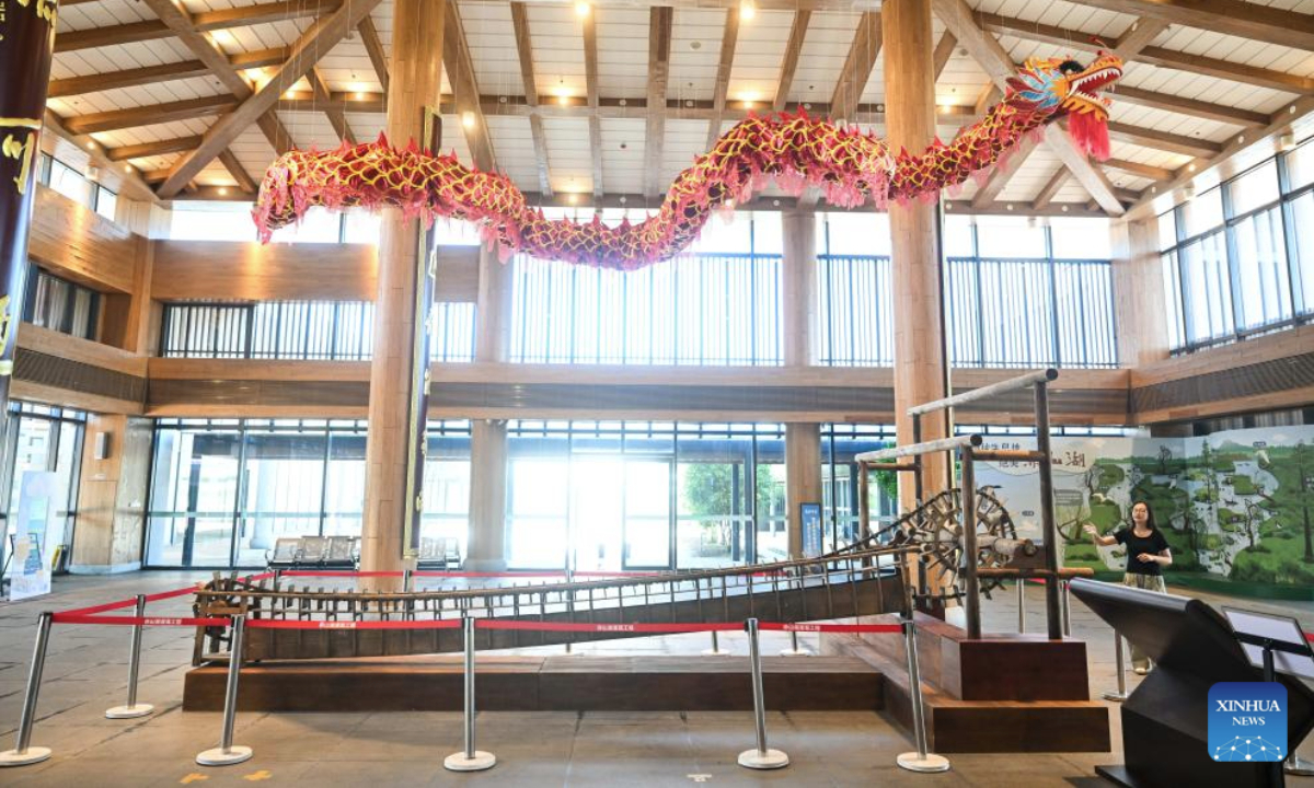 A staff member introduces a traditional water lift at an exhibition hall of the Chishan Lake Irrigation System in Jurong City, east China's Jiangsu Province, on Sept. 15, 2025. The 17-century-old Chishan Lake Irrigation System has recently been added to the World Heritage Irrigation Structures (WHIS) list during the 76th International Executive Council Meeting of the International Commission on Irrigation & Drainage (ICID). The system is still nourishing more than 5,100 hectares of arable lands. (Xinhua/Ji Chunpeng)