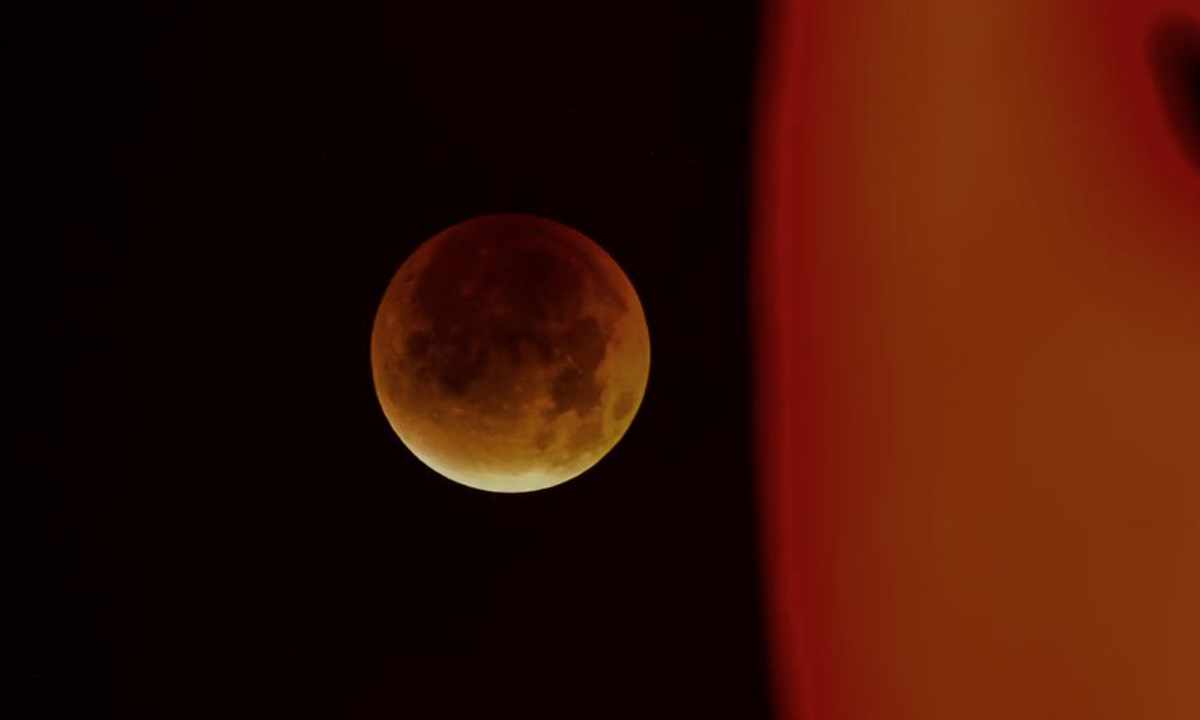 The moon is seen during a lunar eclipse in the sky over Yuqing County of Zunyi City, southwest China's Guizhou Province, Sept. 8, 2025. (Photo by Zhou Lei/Xinhua)