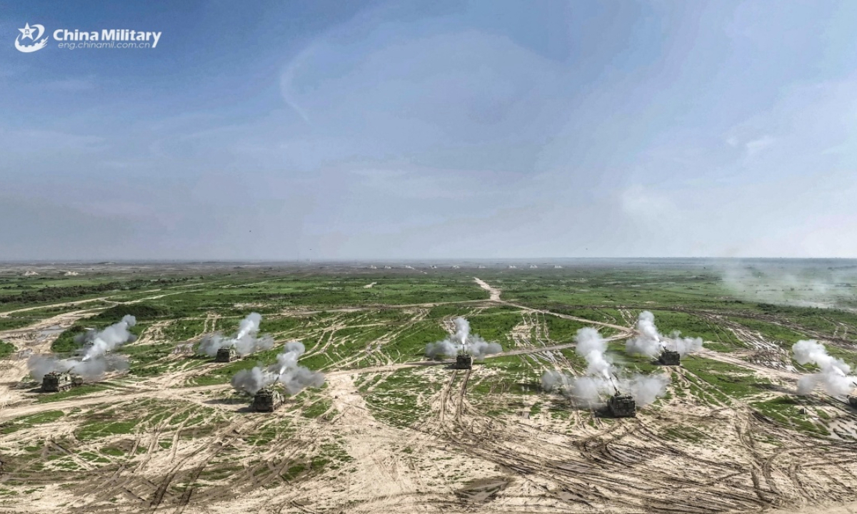 PLZ-05 155mm tracked self-propelled howitzers attached to a brigade under the Chinese PLA 82nd Group Army open fire during a live-fire shooting training exercise in late September, 2025. (eng.chinamil.com.cn/Photo by Wang Zhengjie)