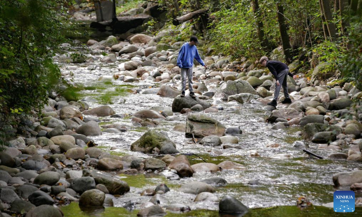 People visit a creek on World Rivers Day in North Vancouver, British Columbia, Canada, Sept. 28, 2025. World Rivers Day fell on Sept. 28 this year. (Photo by Liang Sen/Xinhua)